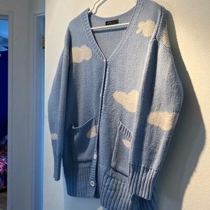 Blue sweater with clouds